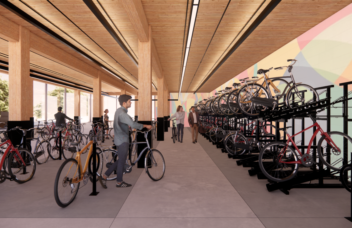 A rendering of the bike storage room, with bike racks and ample sunlight