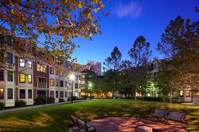 The exterior of the Pleasant Street Condominiums in Cambridge, Massachusetts at night. 