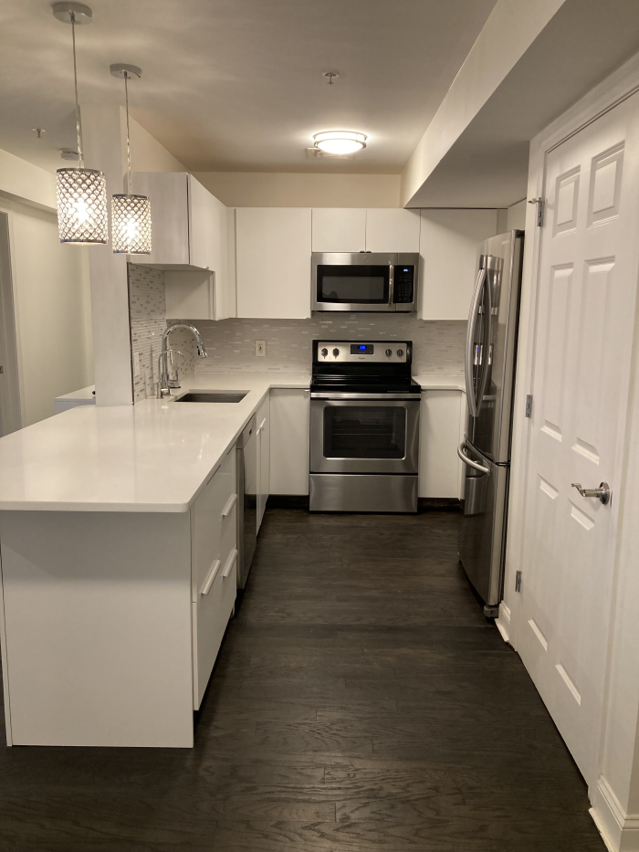 kitchen with white cabinetry and stainless steel appliances