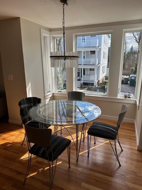dining area with hardwood floors and bay windows