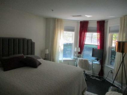 Primary bedroom with bay windows