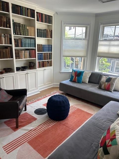 Secondary bedroom with bay windows and hard flooring