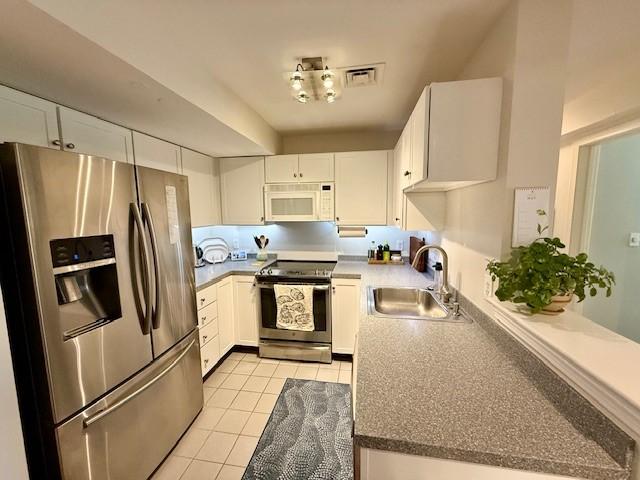 kitchen with stainless steel appliances and tile flooring