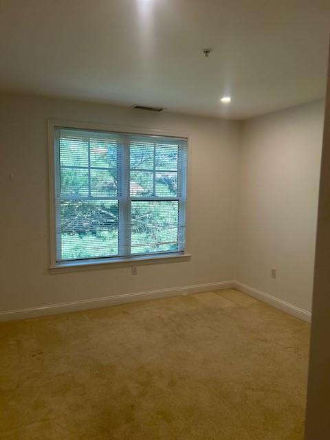 Third bedroom with carpeting and large window