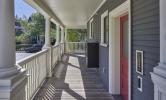 The front porch of 5 Sacramento, with a mailbox for all units placed outside the front door