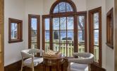 Howells House sitting nook, with two chairs facing a small round table within a bay window area