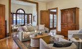 A furnished living room space with cozy couches, a coffee table, and rug.