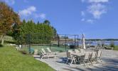 A view of the Sport Court facing the water, and the patio nearby for gathering