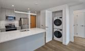 2 Bedroom unit with view of laundry closet, stacked washer and dryers