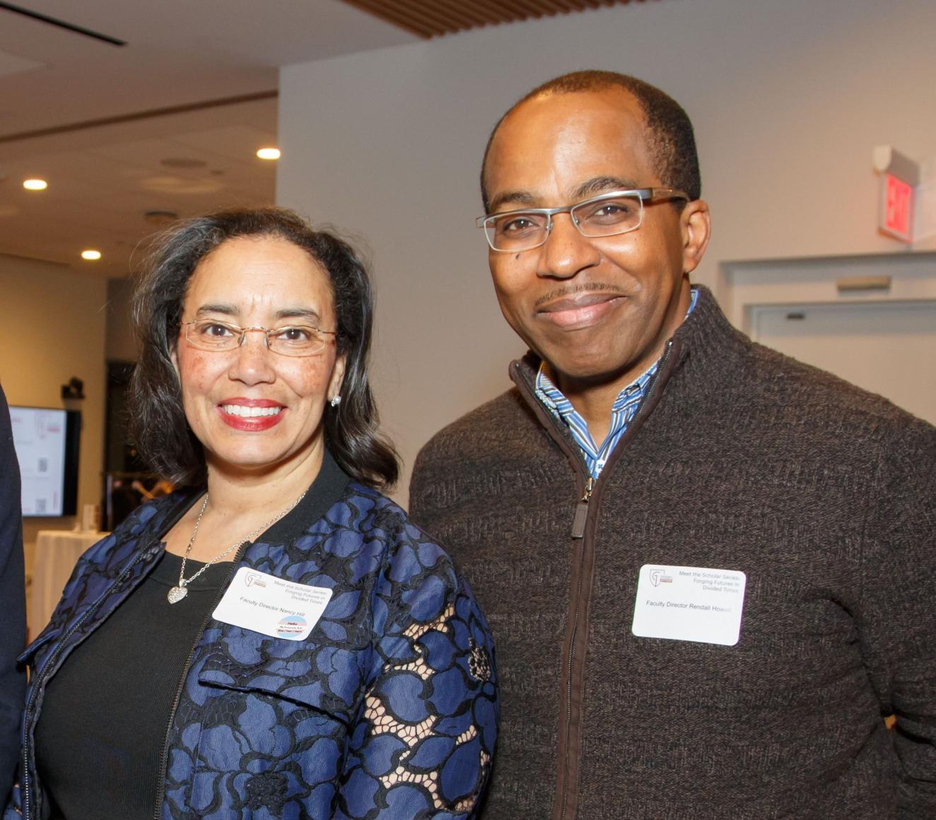 Faculty Directors Professor Nancy Hill & Rendall Howell posing together at an event