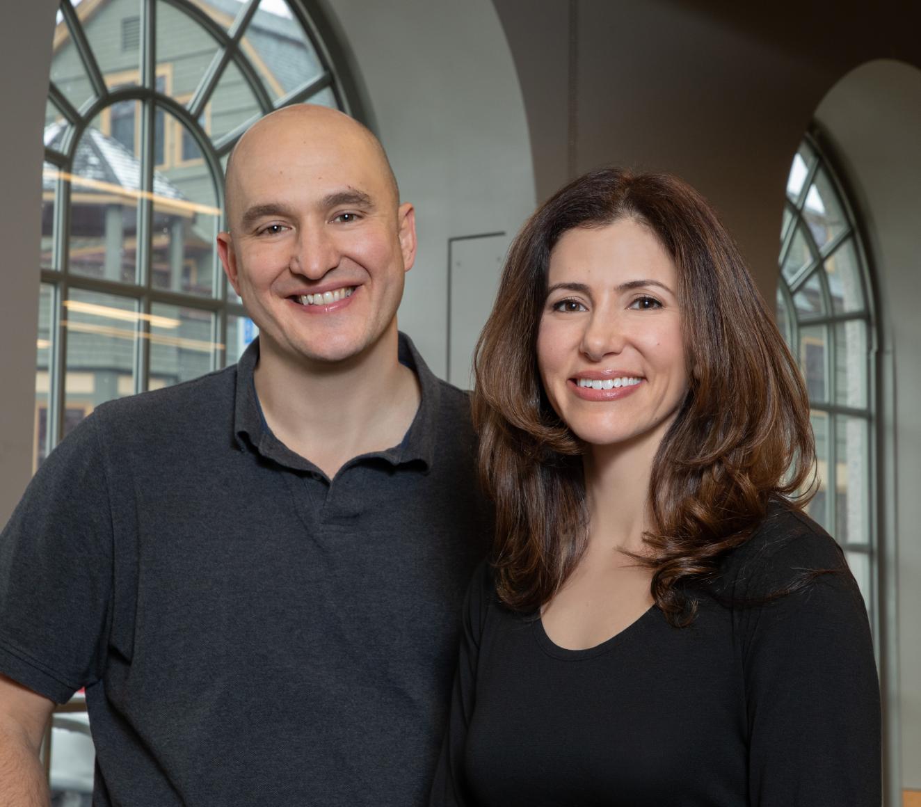 Todd Rogers and Sarah Dadkhah posing together and smiling for the camera.